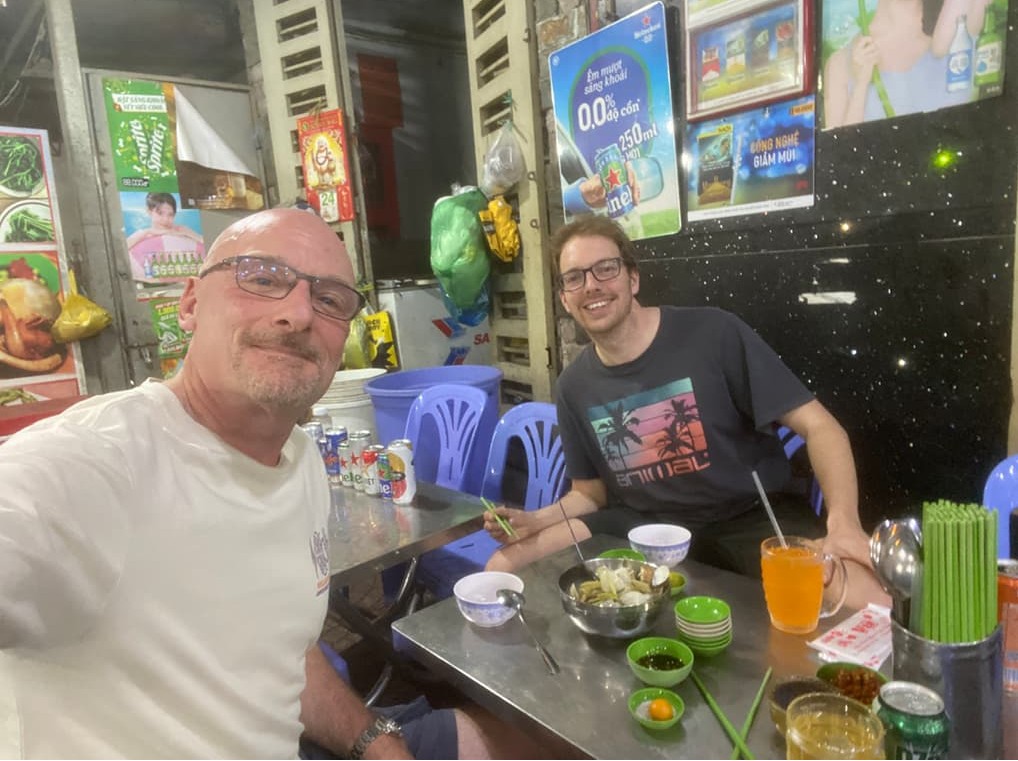 Tom and Chris eating Vietnamese street food