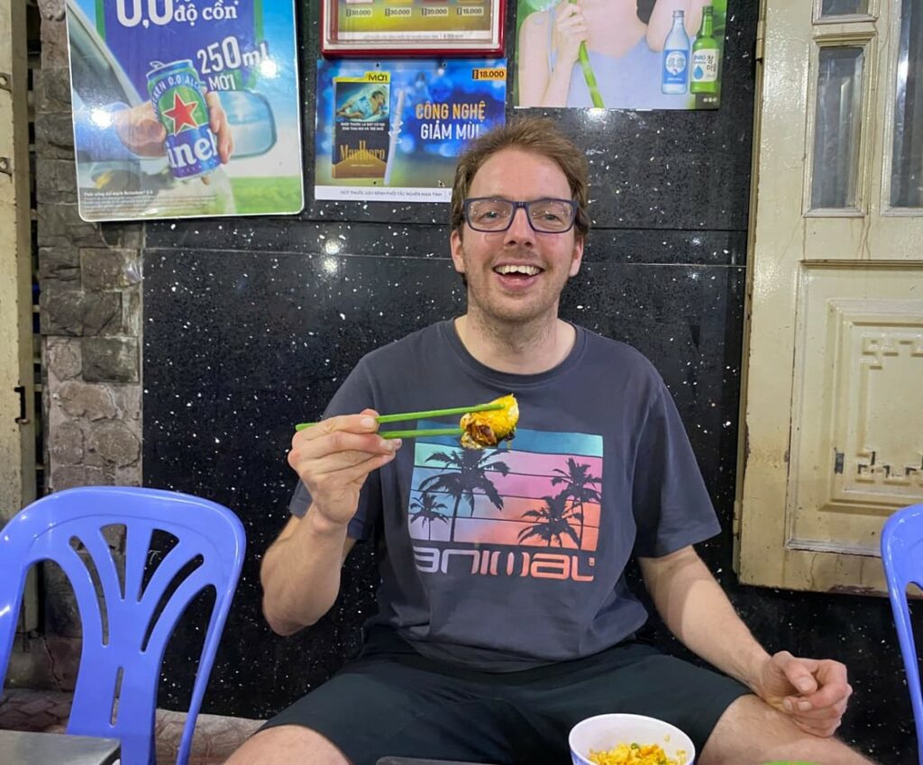 Tom eating Vietnamese street food