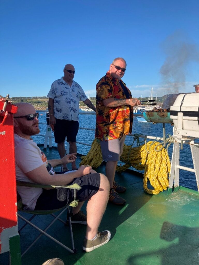 Crew members with barbecue on board Gry Maritha