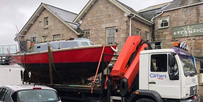 Boat being transported after being recovered - Isles of Scilly Freight