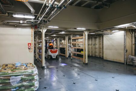 Inside Menawethan's hold with a forklift placing cargo