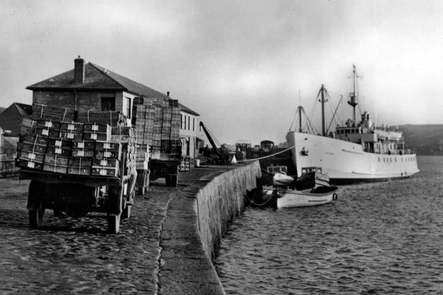 Historic image showing freight being delivered to St Mary's Quay, Isles of Scilly to be loaded on to Scillonian II