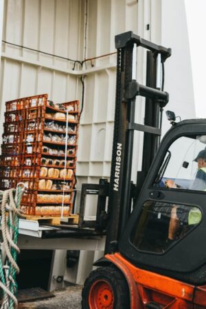 Forklift truck loading the freight onto the ship Menawethan