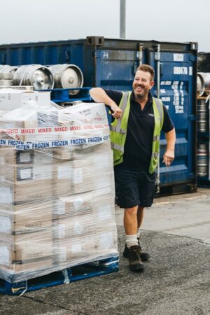 freight team member next to cargo