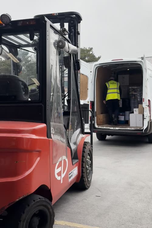 unloading a van outside the warhouse
