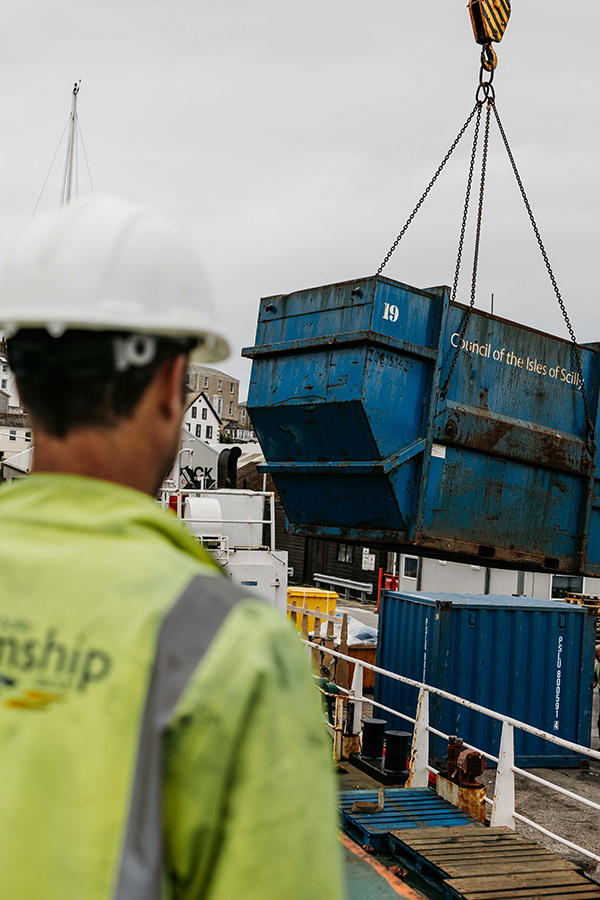 Isles of Scilly Council waste containers being lifted of the Gry Maritha by crane