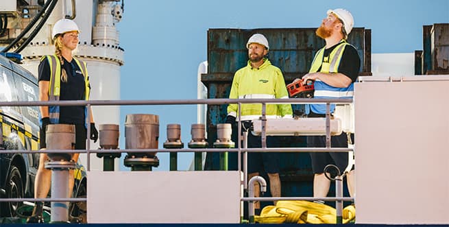Menawethan's crew unloading the freight ship