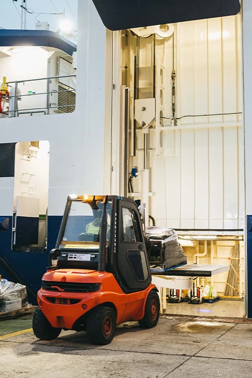 Forklift truck loading a pallet onto Menawethan