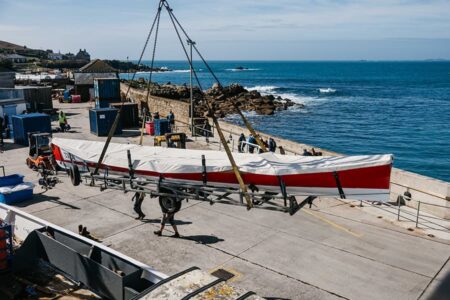 Pilot gig being craned off of Scillonian III on to St Mary's quay