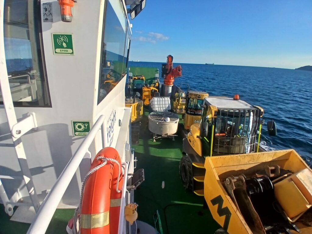 Building equipment aboard Isles of Scilly Freight's vessel, Gugh.